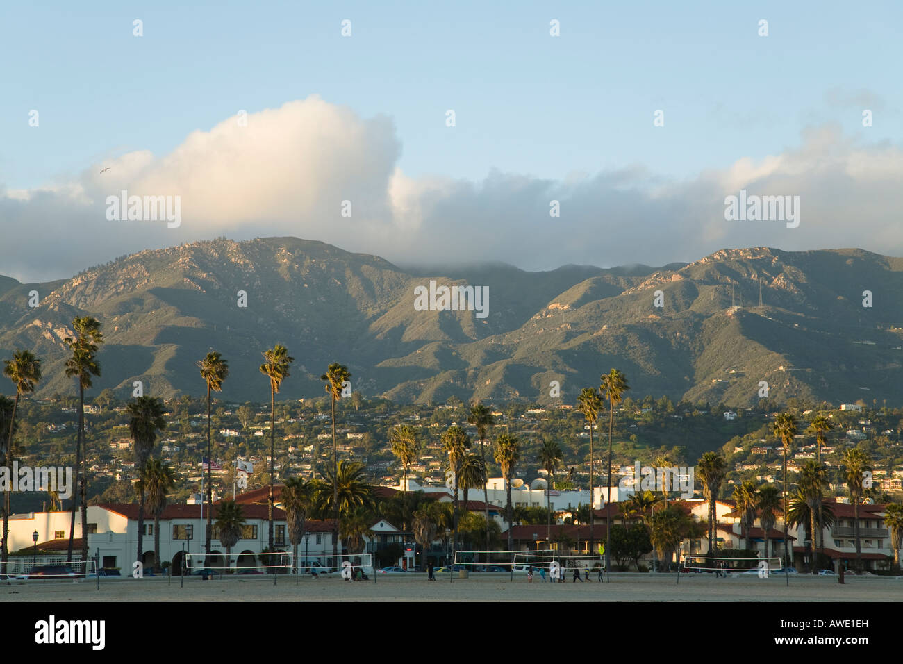CALIFORNIA Santa Barbara Volleyball nets on West Beach hotels and palm trees Cabrillo Boulevard city buildings mountain Stock Photo
