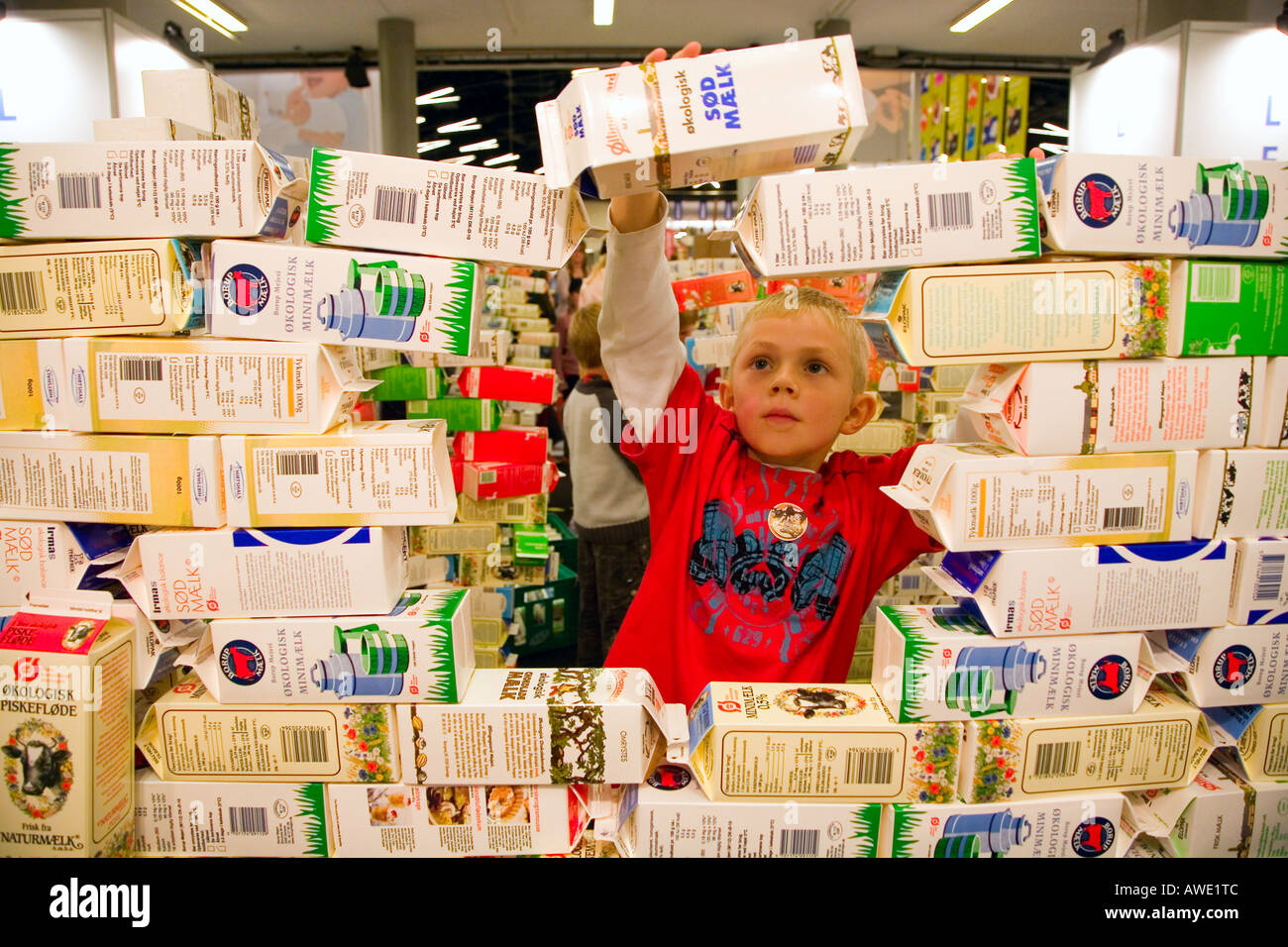 Children building a castle of milk cartons Stock Photo Alamy