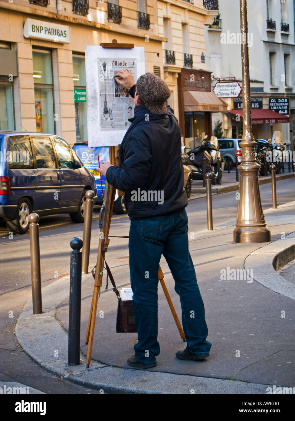 French artist sketches a scene in a Paris street, art in Paris France Europe Stock Photo