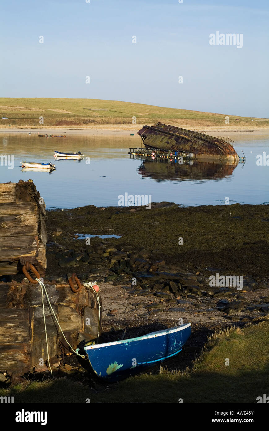 dh 3rd Churchill Barrier CHURCHILL BARRIERS ORKNEY Fishing boats and wrecked block ship hull Weddel Sound ww naval history Stock Photo