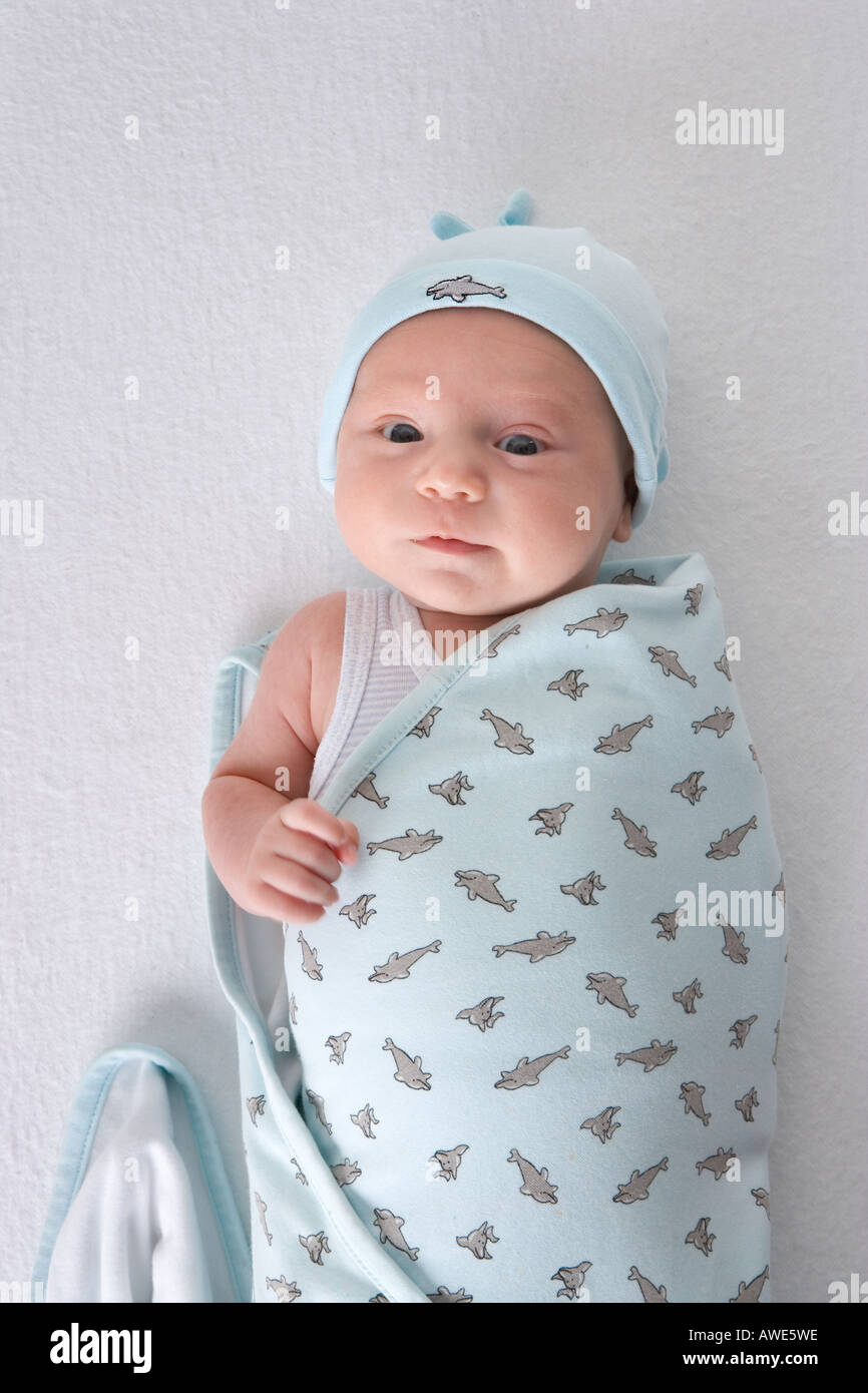 Baby wrapped in a towel Stock Photo Alamy