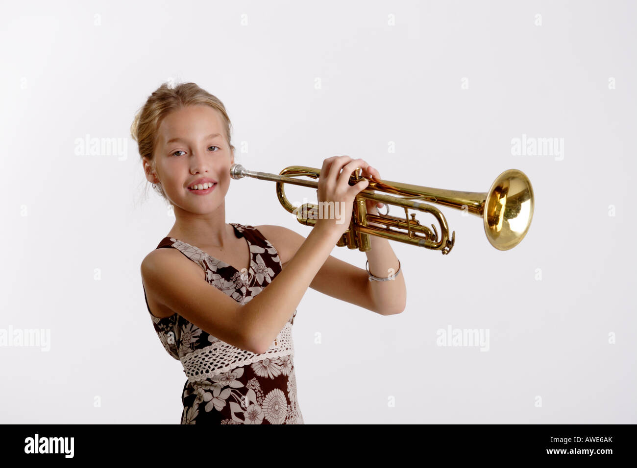 Stock Photograph of a young girl playing the trumpet Stock Photo - Alamy
