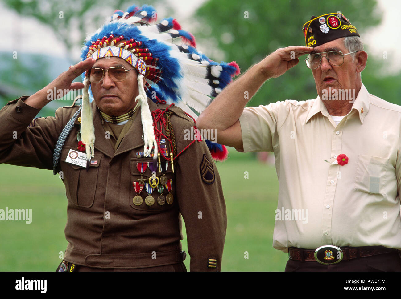 World War II veterans, native american, left, salute at Memorial Day ceremony Stock Photo