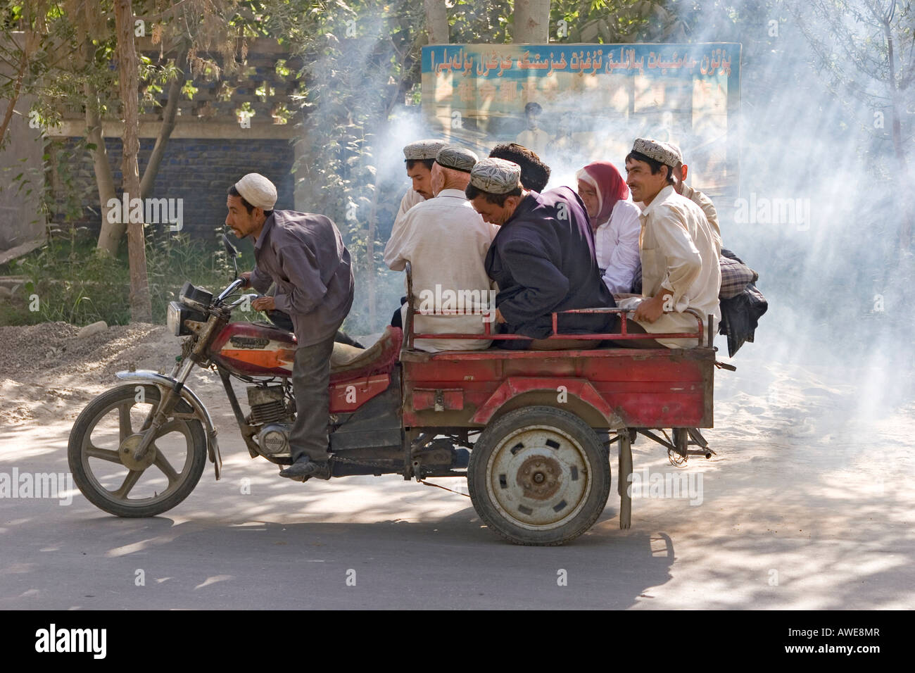 Asia, china, group of men on bike near khotan at silkroad. Stock Photo