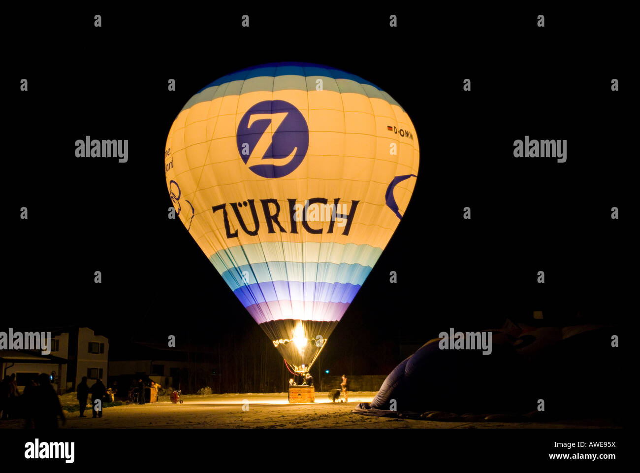 Hot-air balloon glowing against a dark sky, Koessen, Tirol, Austria, Europe Stock Photo