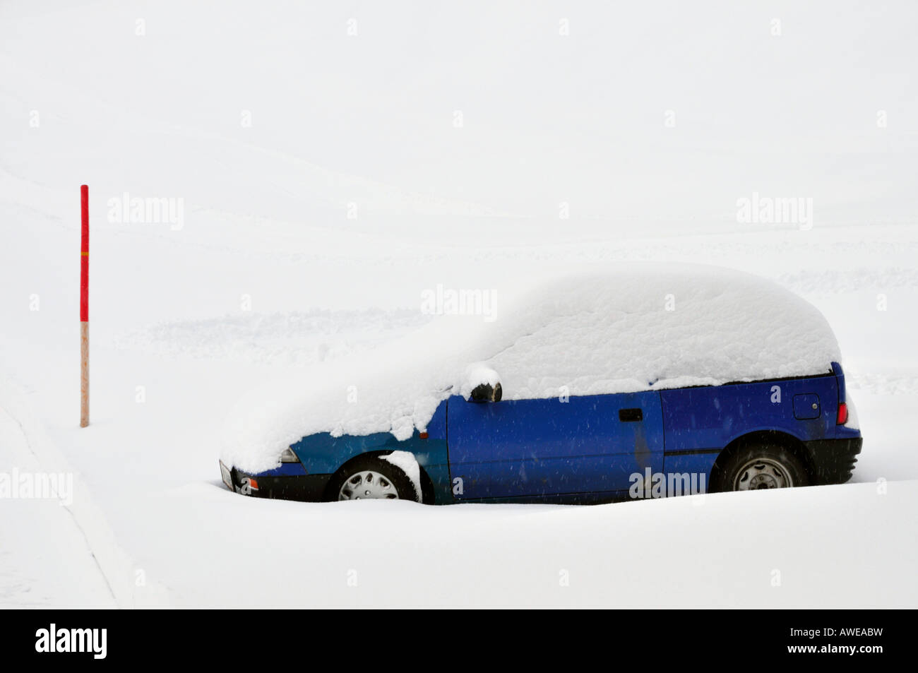 Snow covered car in Kleinwalsertal, Austria, Europe Stock Photo