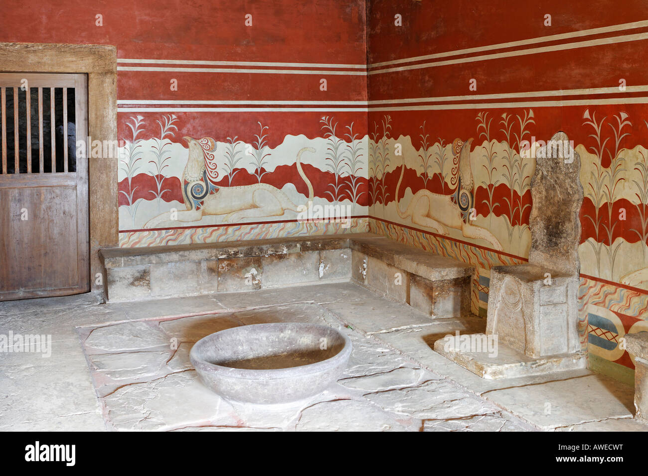 King Minos' alabaster throne surrounded by frescoes depicting chimeric animals in the Palace of Knossos, Crete, Greece, Europe Stock Photo