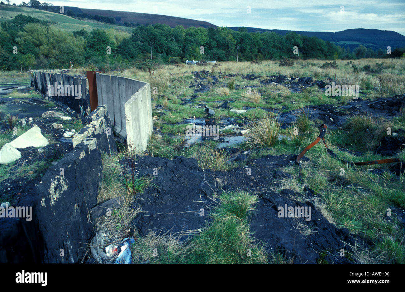 Hazardous and toxic waste at abandoned site near Abercwmboi in Cynon Valley South Wales Stock Photo