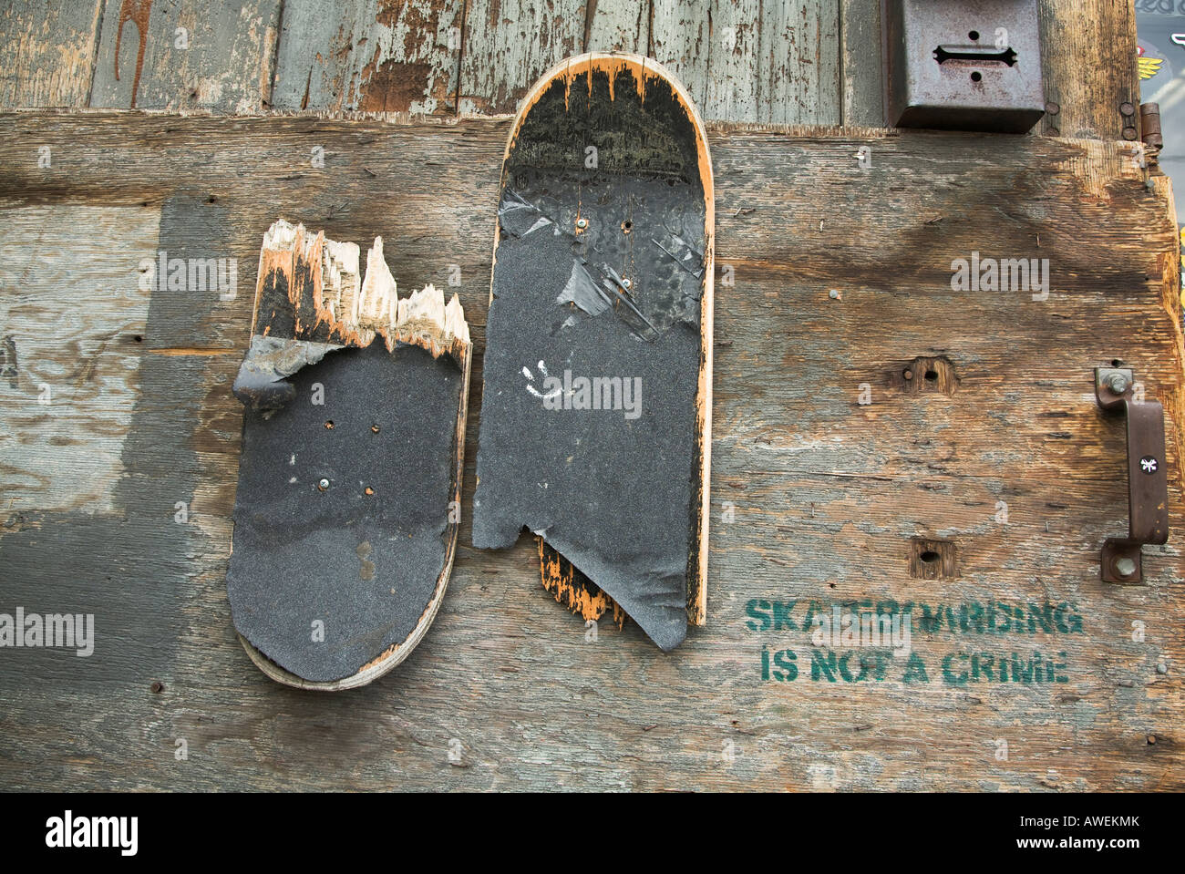 CALIFORNIA Santa Barbara Broken skateboard nailed to wooden wall
