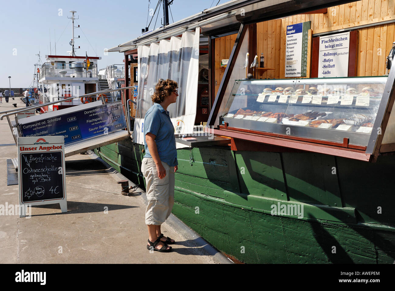 Seafood vendor and bistro on a boat, Sassnitz, Ruegen, Germany, Europe Stock Photo