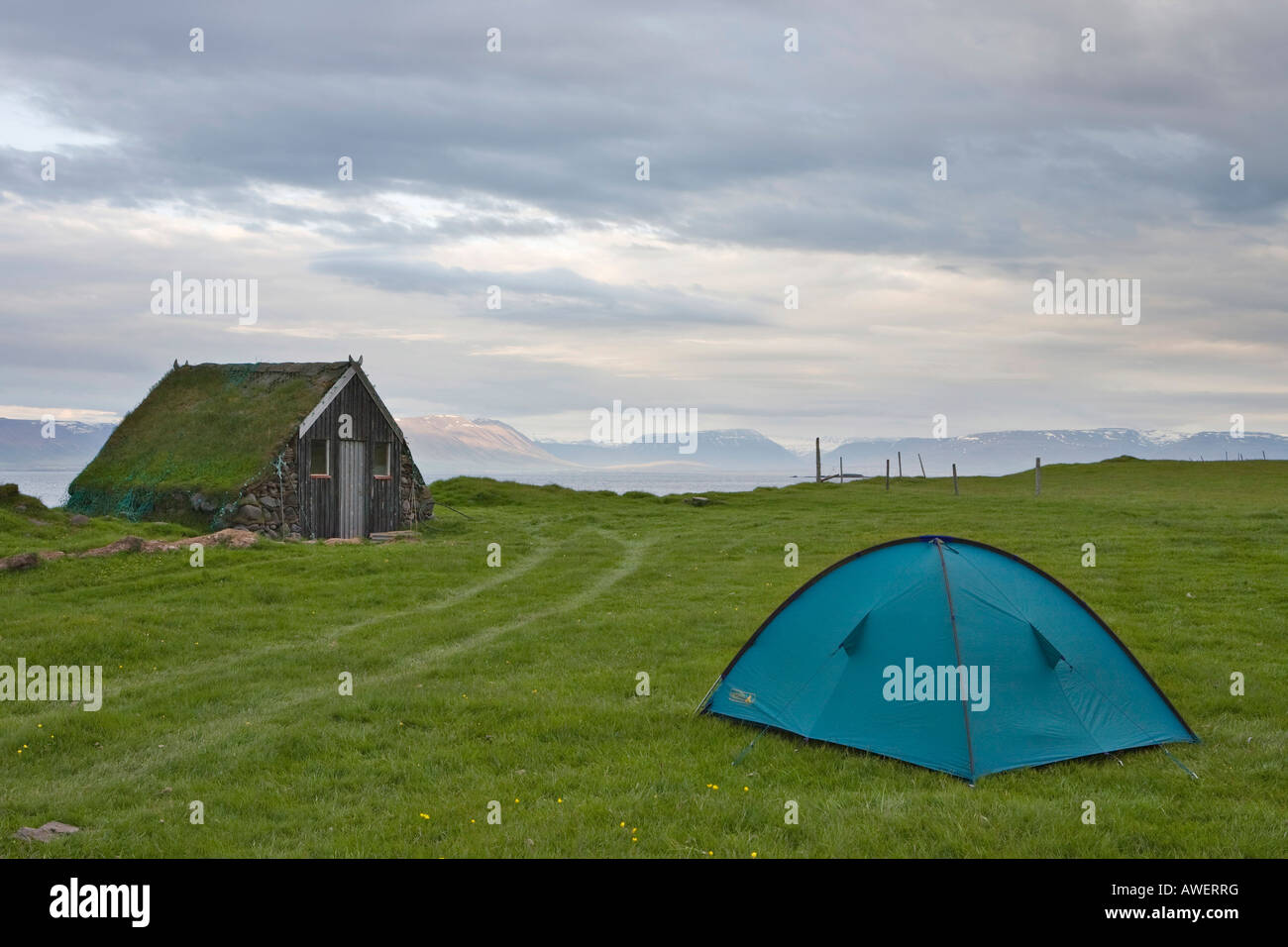 Small cabin and tent set up beside Grettislaug swimming hole, Reykjadiskur, northern Iceland, Iceland, Atlantic Ocean Stock Photo