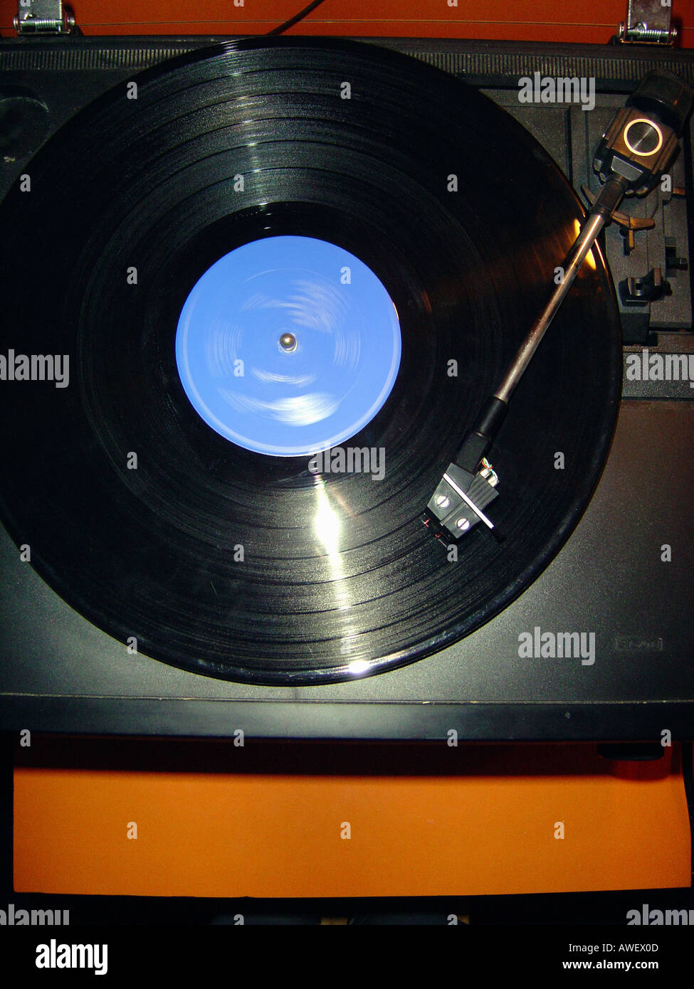 Vinyl LP Record Spinning and Playing on a Turntable Record Player Viewed From Above Copy Space Stock Photo