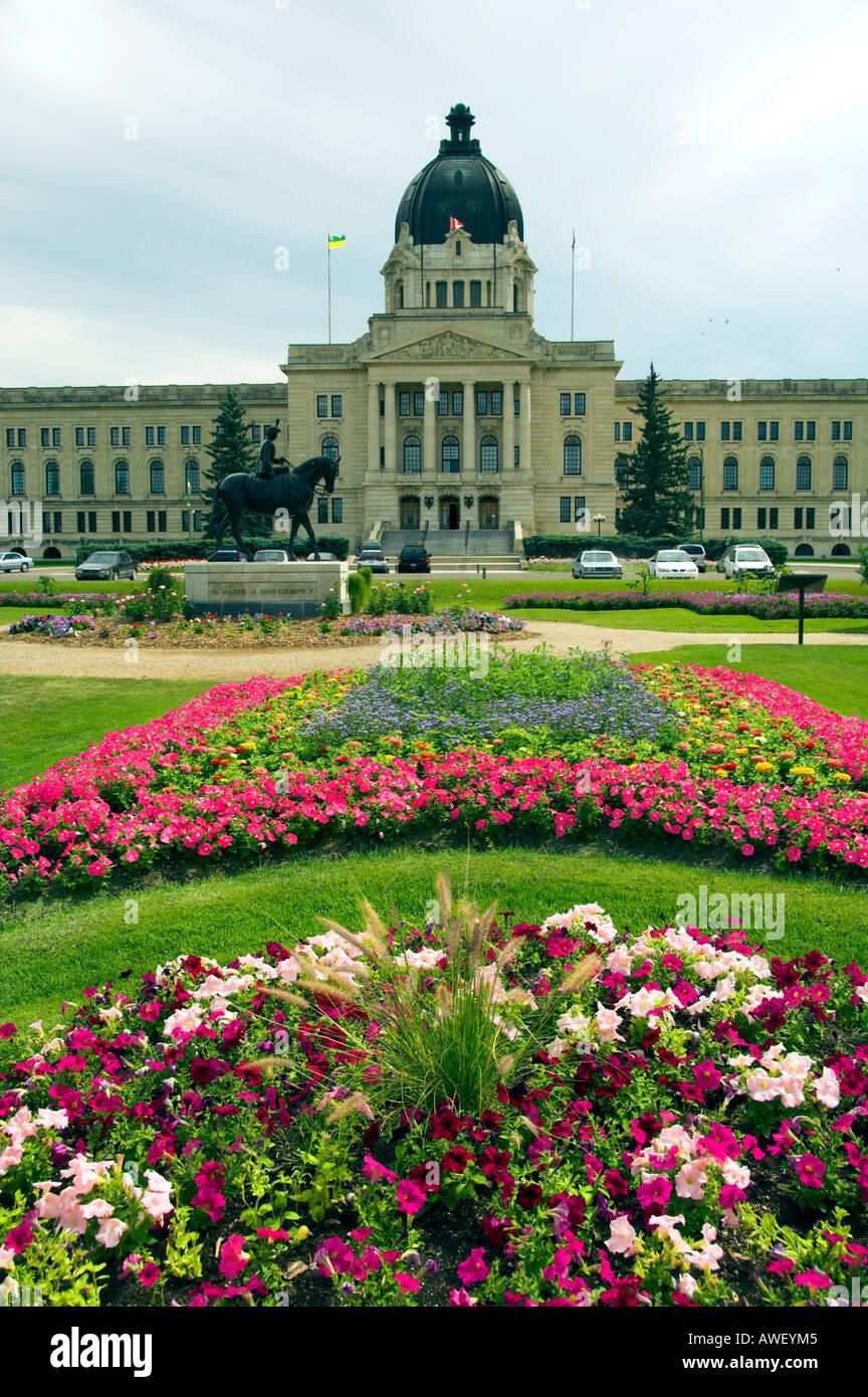Formal flower gardens and the Saskatchewan Provincial legislative buildings in Regina Saskatchewan Canada Stock Photo