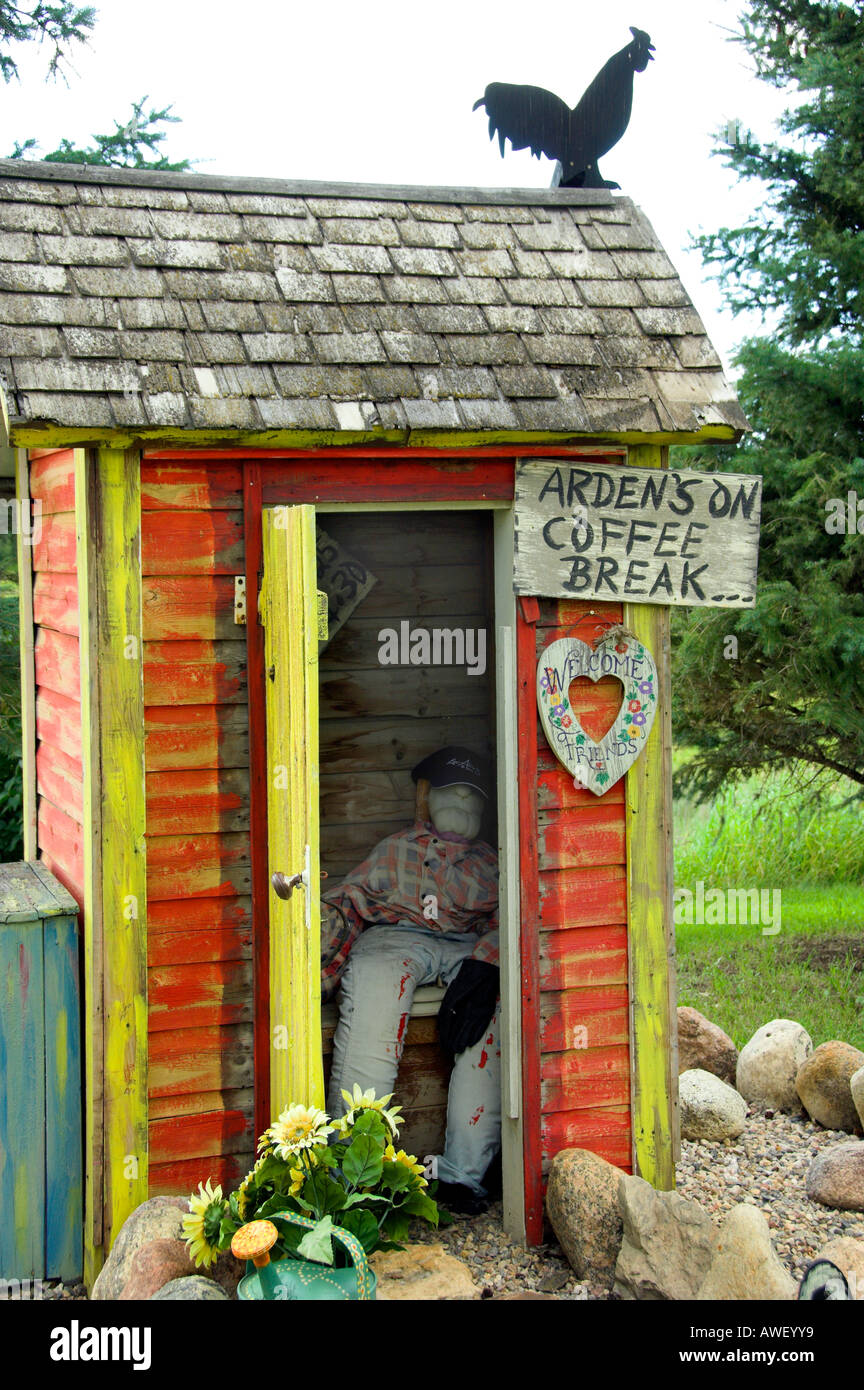 A colorful outdoor outhouse with unique decor at Waldheim Saskatchewan