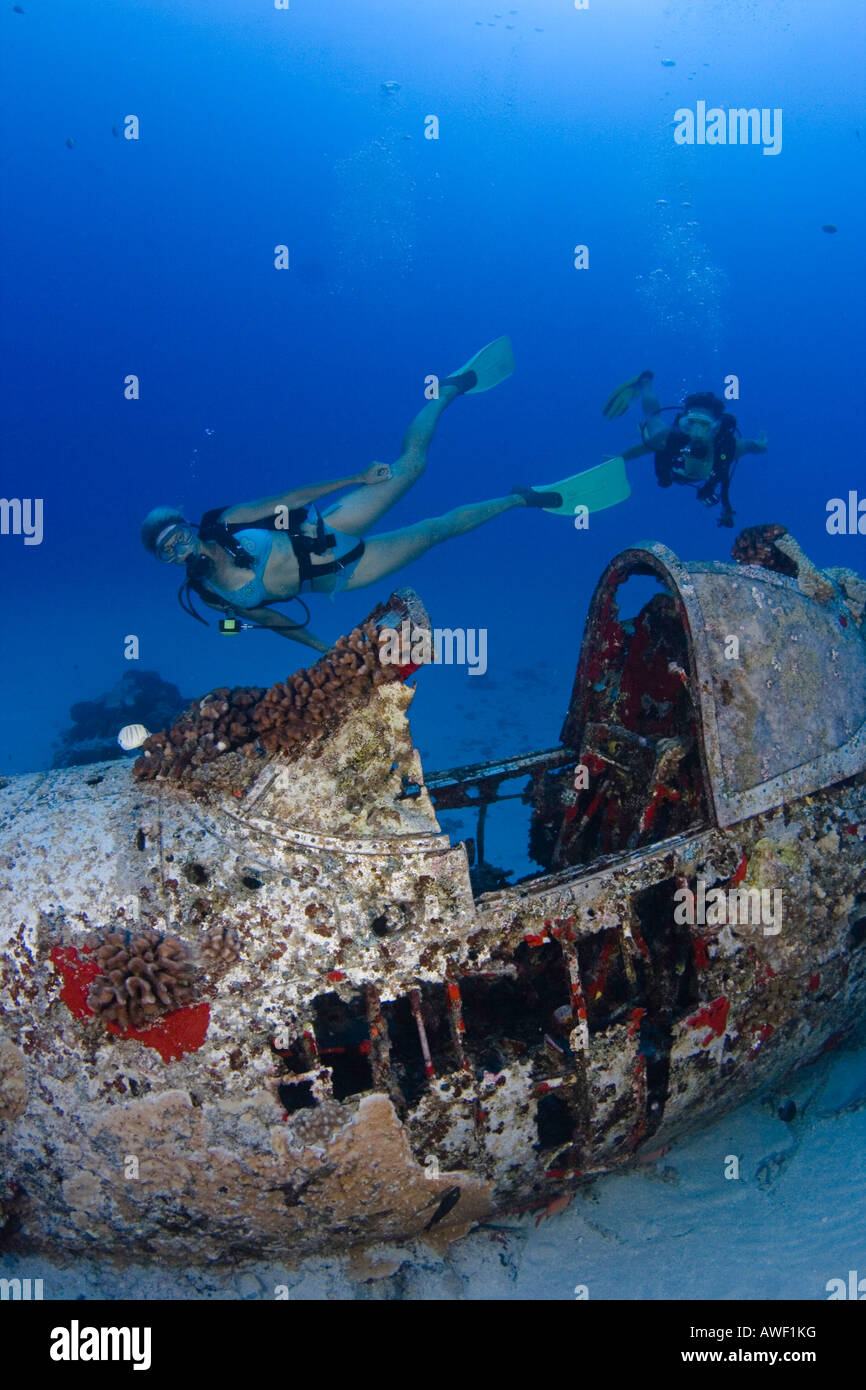 Divers on a WW II Corsair fighter plane off South East Oahu, Hawaii. Stock Photo