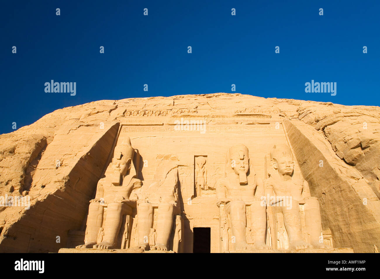Abu Simbel Temple Statues of Ramses II in early morning sun sunshine