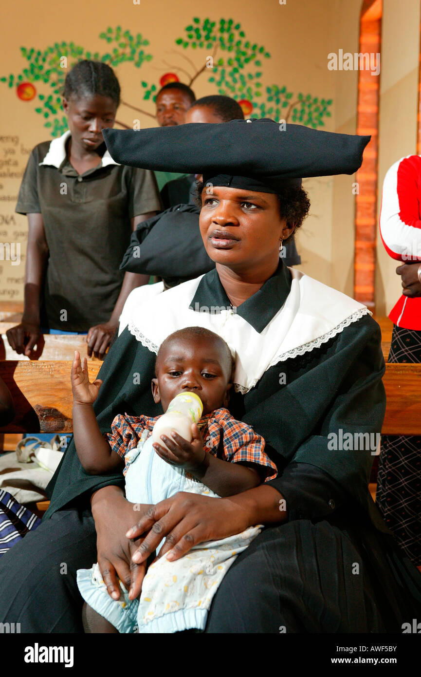Mother and child during church service, Sehitwa, Botswana, Africa Stock Photo
