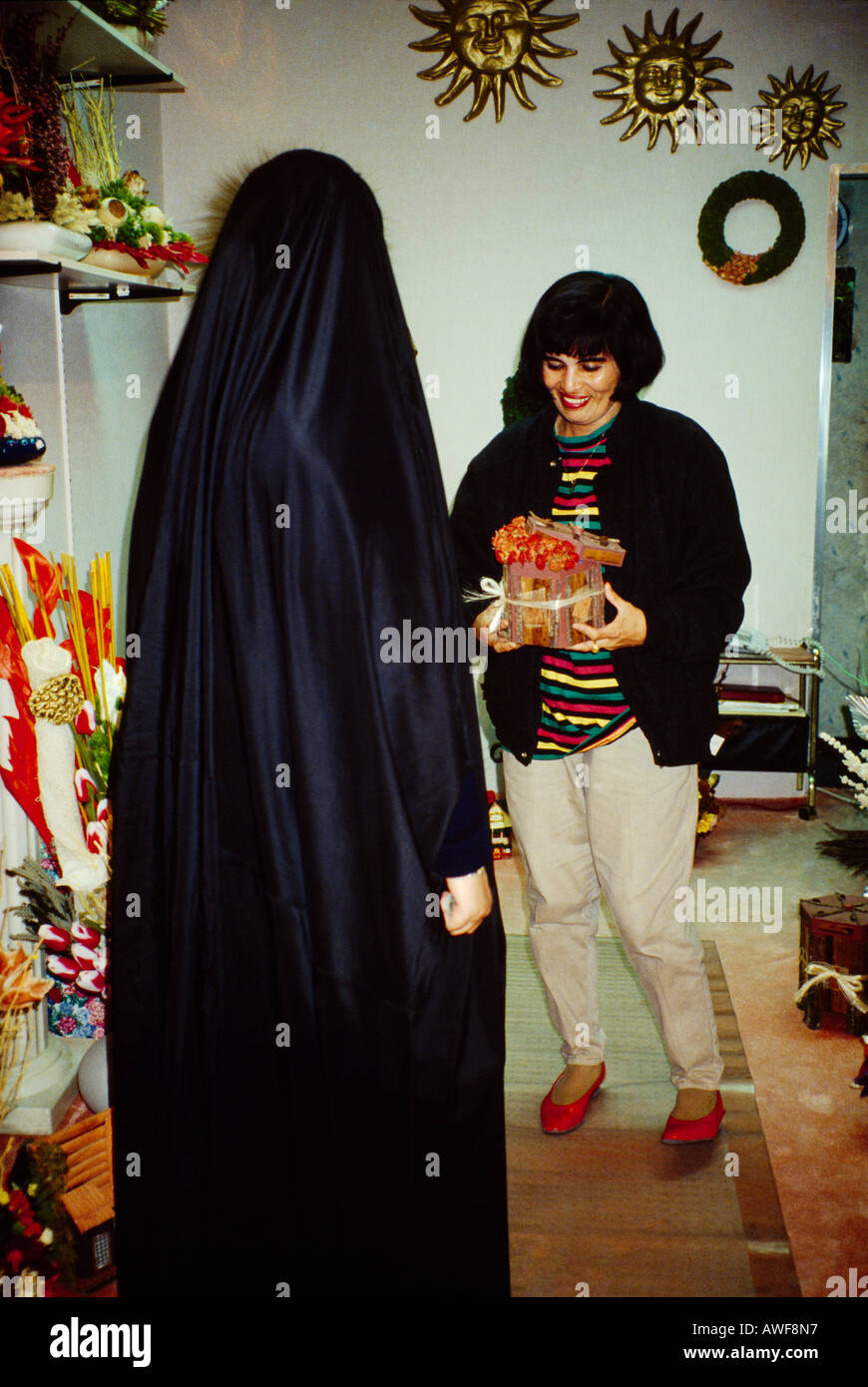 Kuwait City Kuwait Veiled Bedouin Woman Shopping In Flower Shop Stock