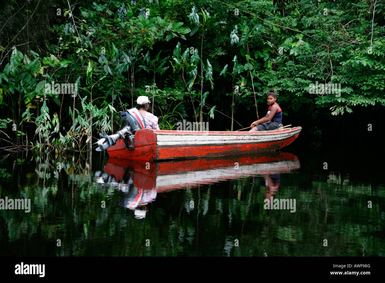 A boat as a means of transport on the Kamuni river, rain forest of Guayana, South America Stock Photo