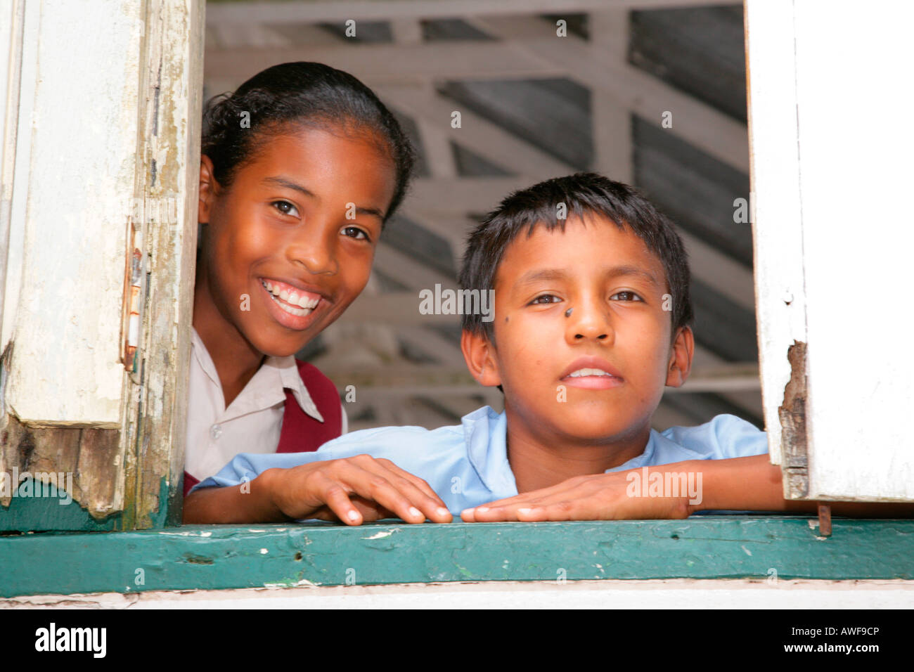 Pupils in uniform during break, Amerindians, tribe of the Arawak, Santa Mission, Guyana, South America Stock Photo