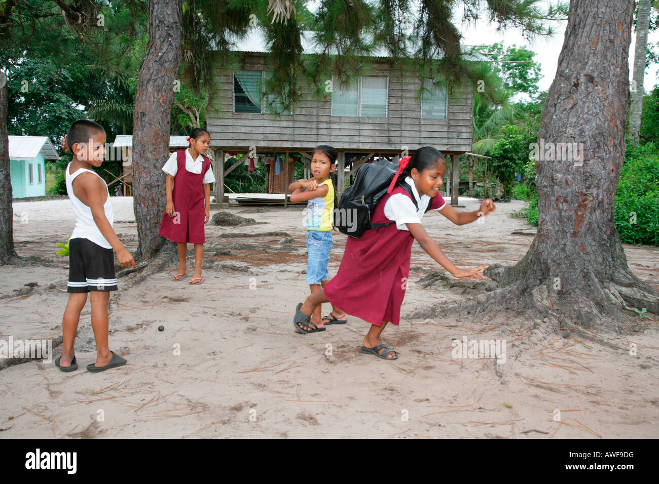 Pupils in uniform during break, Amerindians, tribe of the Arawak, Santa Mission, Guyana, South America Stock Photo