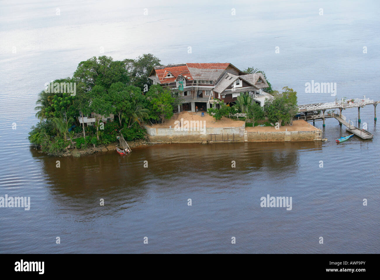 Aerial view of a house built on an island in Demerara River, Guyana, South America Stock Photo