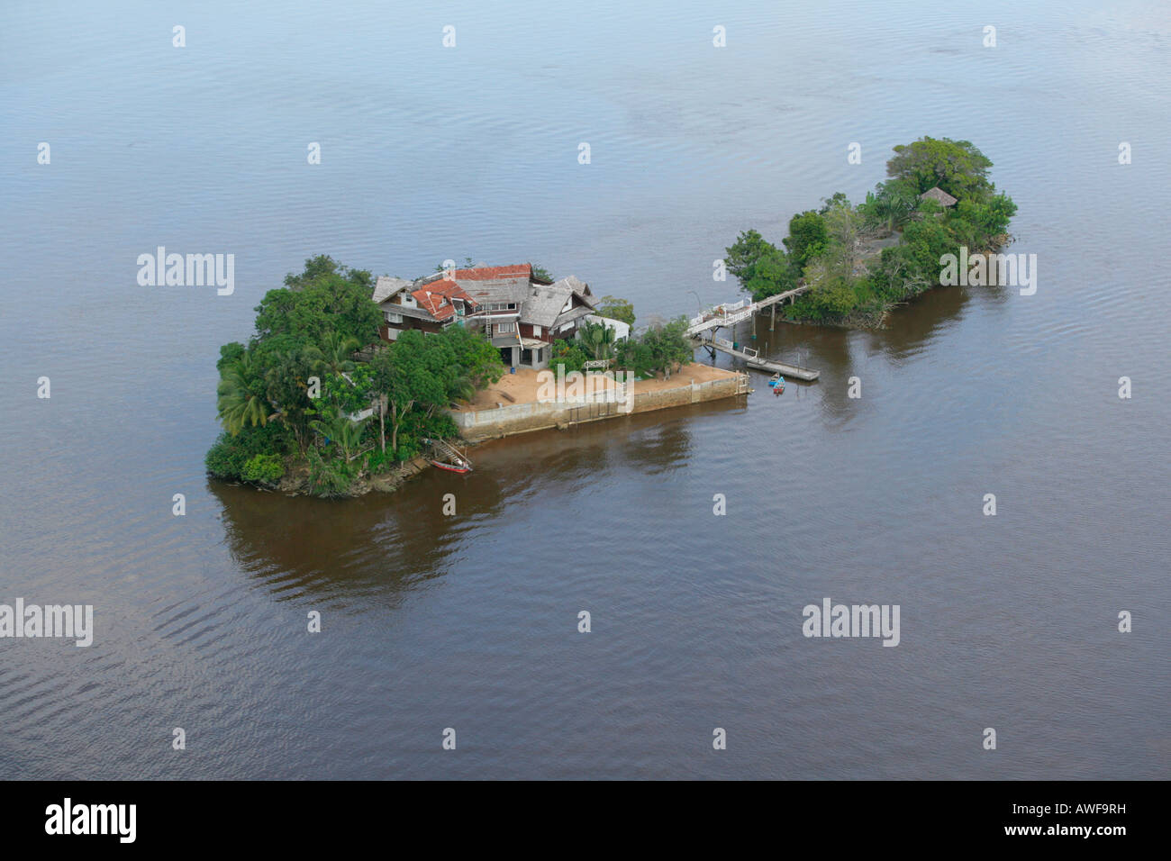 Aerial view of a house built on an island in Demerara River, Guyana, South America Stock Photo