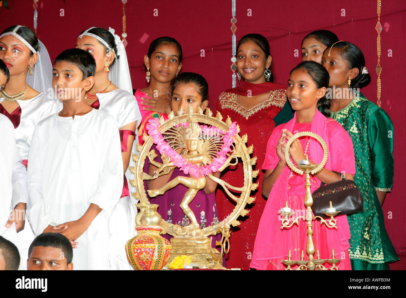Children of Indian ethnicity with Shiva figure at a Hindu Festival in ...