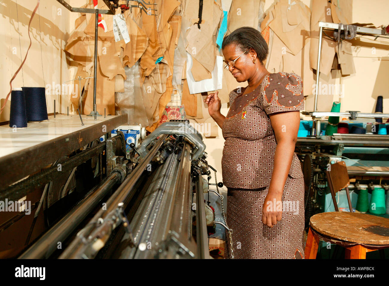 Women in a dress at a tailor's shop, HIV/AIDS aid organization, Gaborone, Botswana, Africa Stock Photo
