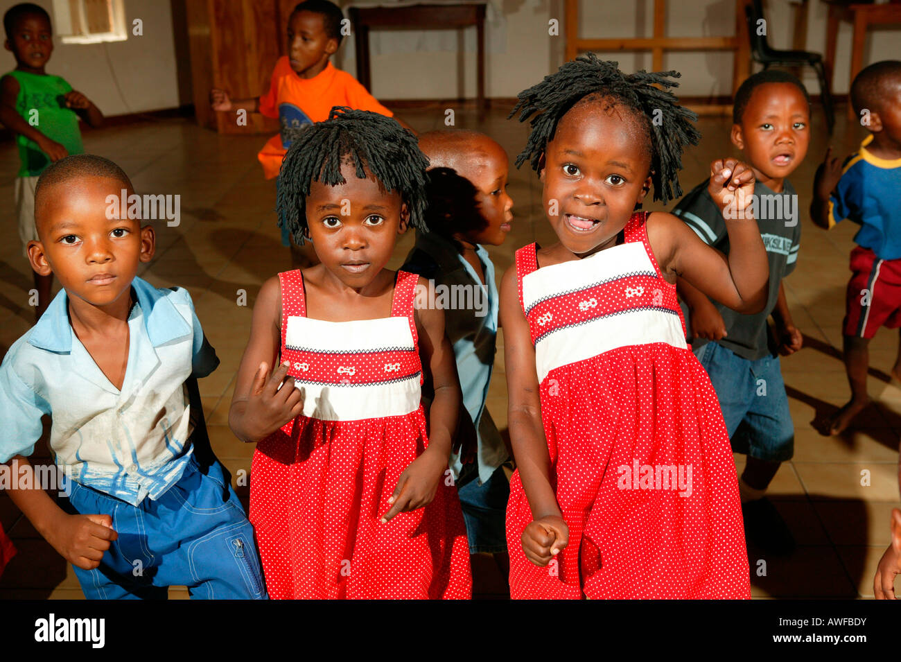 Children, twins singing and dancing at a kindergarten, Gaborone, Botswana, Africa Stock Photo