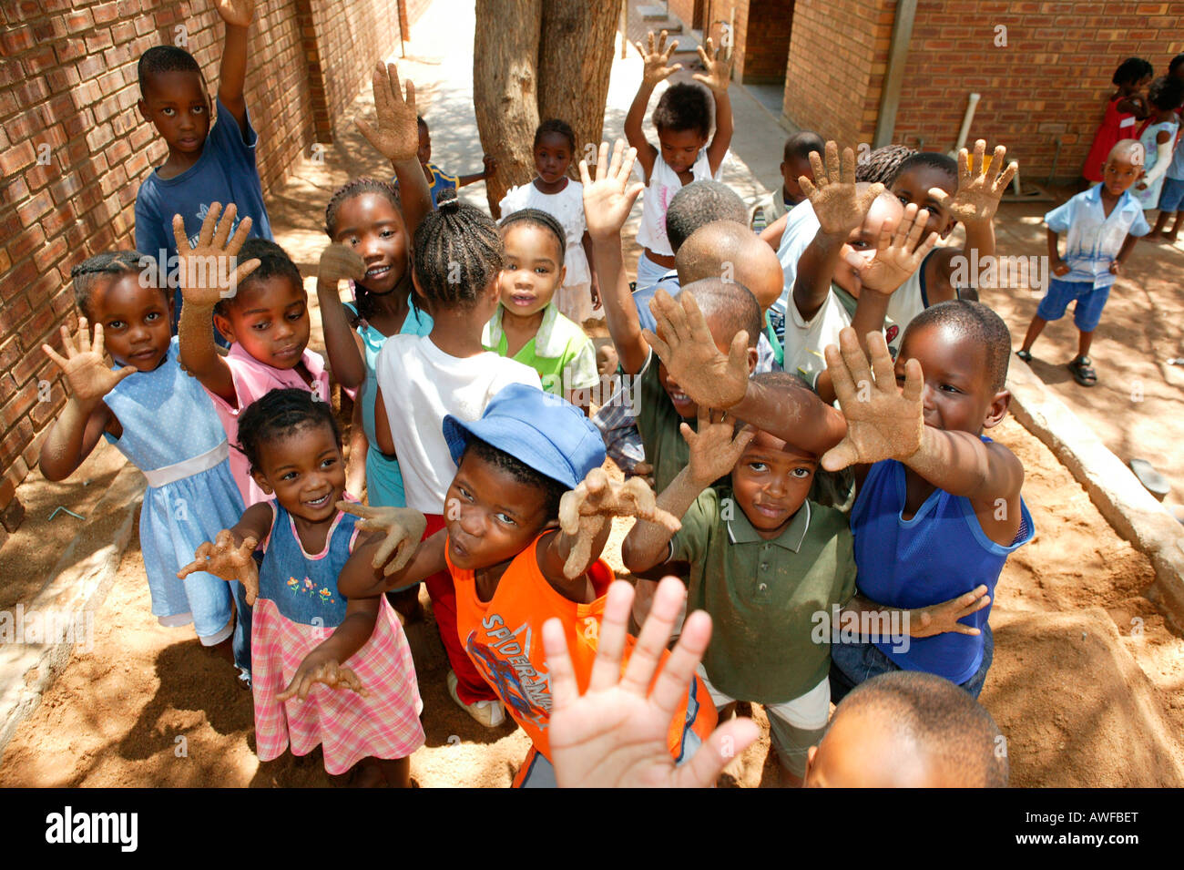 Children showing their sandy hands at a kindergarten, Gaborone, Botswana, Africa Stock Photo