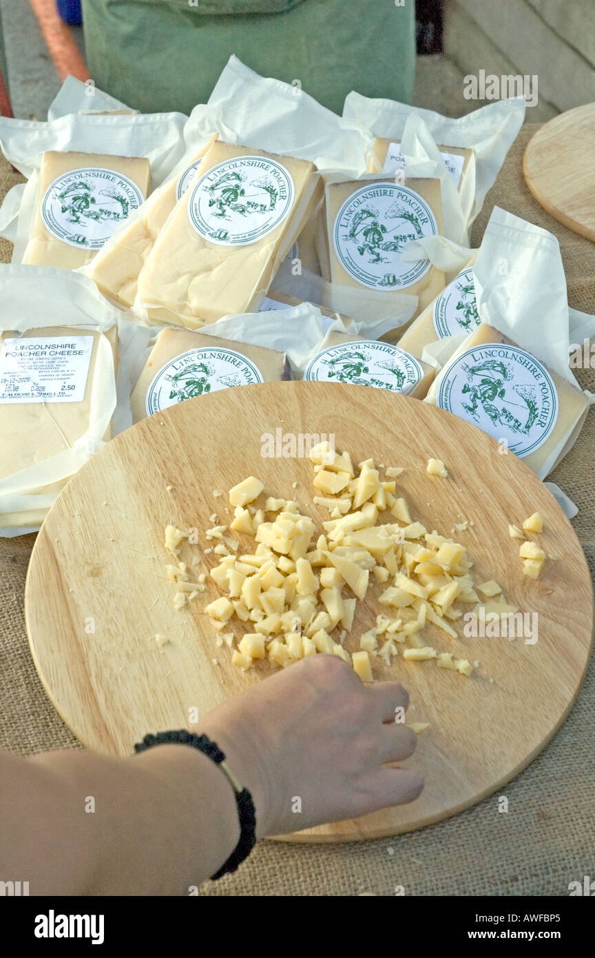 Cheese sampling food local samples hand board stall female hires stock