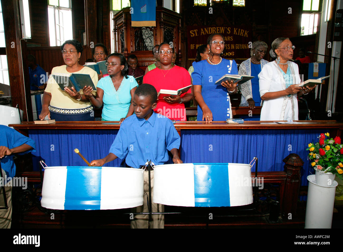 Boy playing steelpan (steeldrum) as part of the choir at St. Andrew