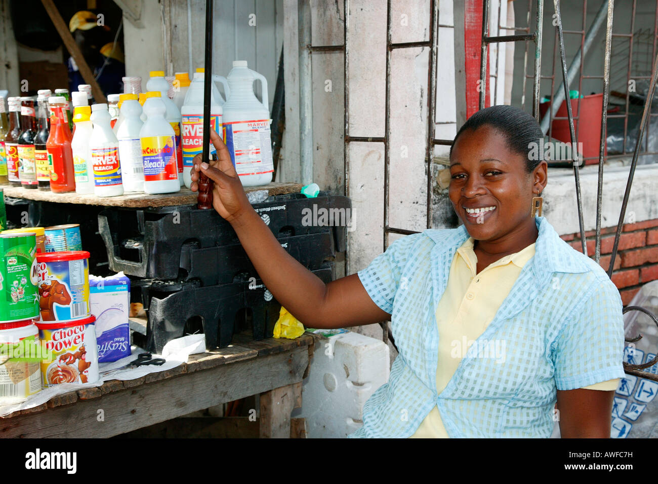 Vendor behind a small stall at a marketplace in Georgetown, Guyana, South America Stock Photo
