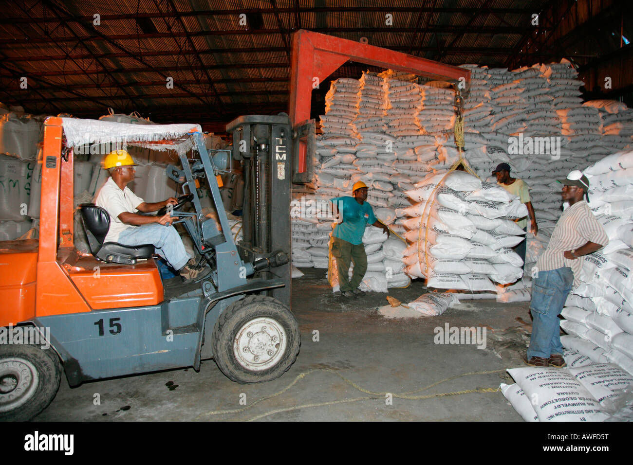 Sacks of sugar in a warehouse at John Fernandes transshipment port in Georgetown, Guyana, South America Stock Photo