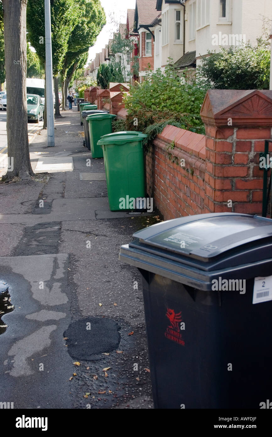 Black rubbish green recycling wheelie bins in a Cardiff suburb Penylan Cardiff UK Stock Photo