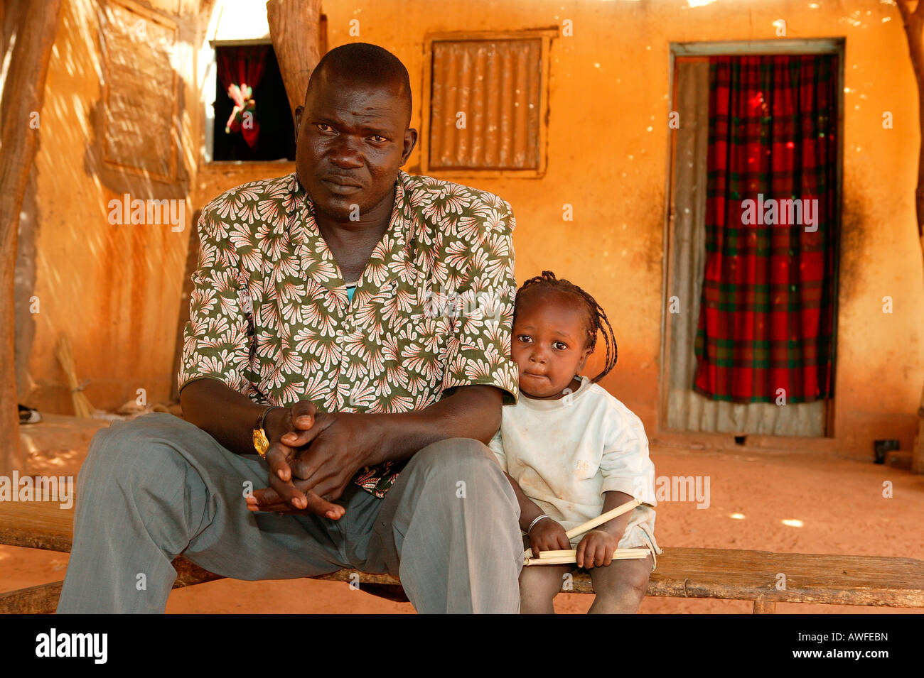 Father and half-orphaned child, HIV/AIDS infected, Cameroon, Africa ...