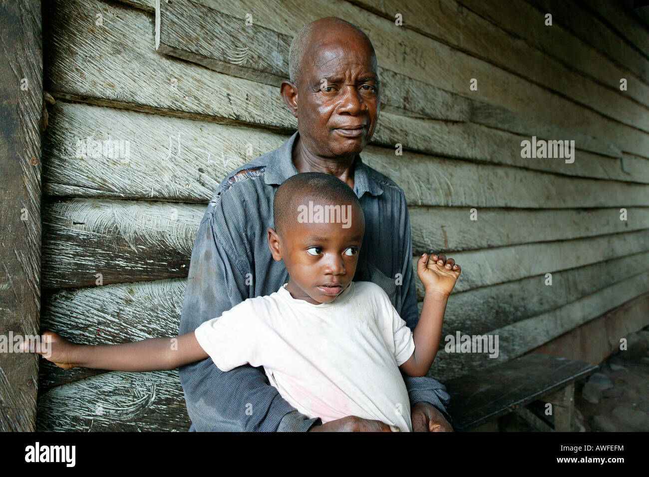 Grandfather and grandchild, AIDS orphan, Cameroon, Africa Stock Photo