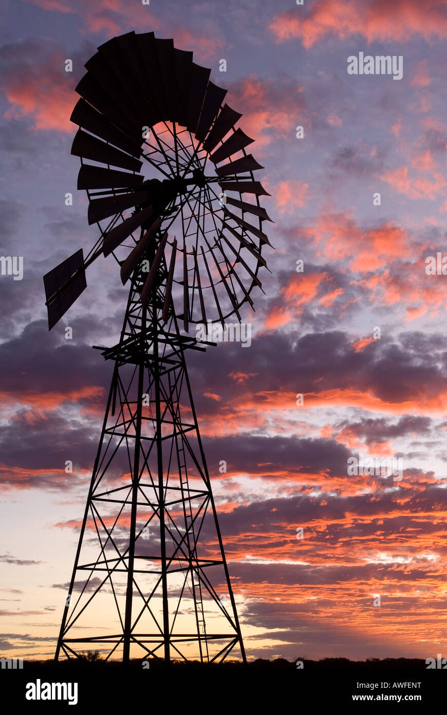 Silhouette of windmill in the Australian Outback Stock Photo