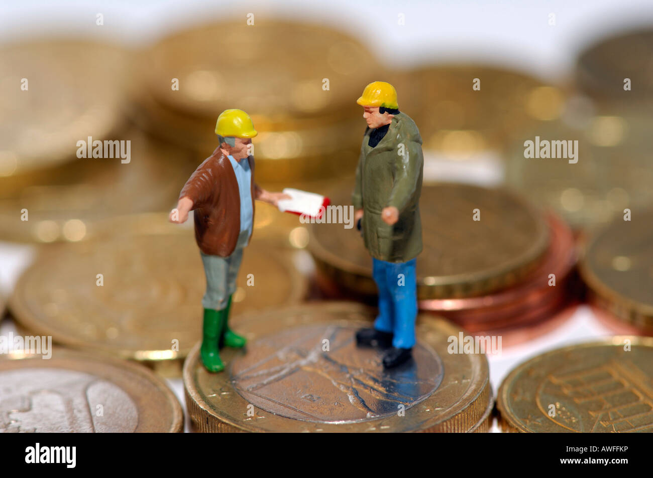 Symbolic photo, workers and coins Stock Photo