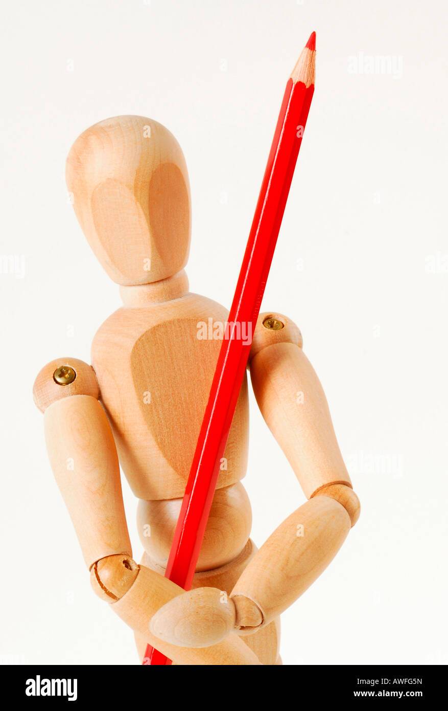 Jointed doll with red pencil Stock Photo