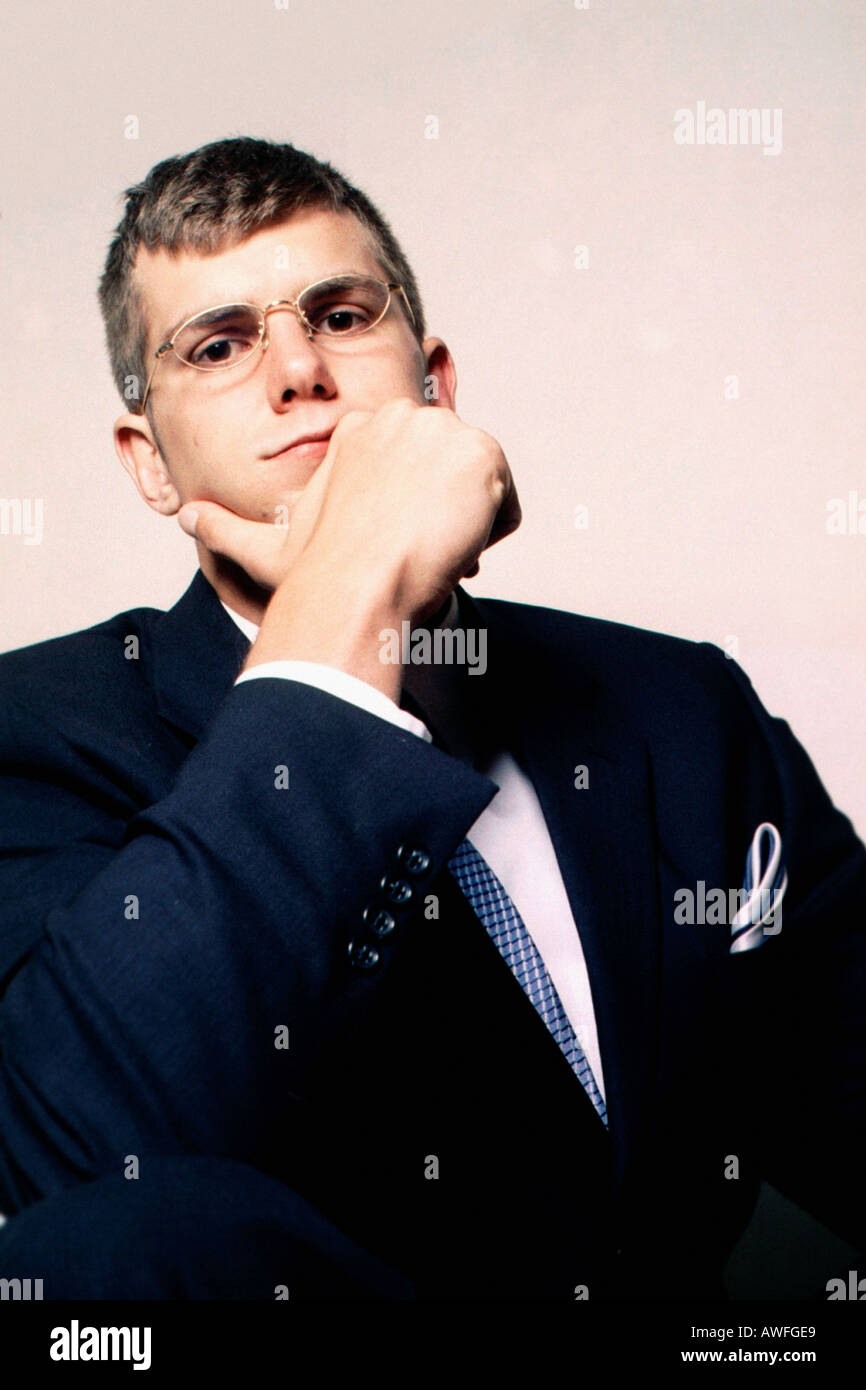 Portrait of a Young Businessman in a Suit His Hand is Near His Chin and ...