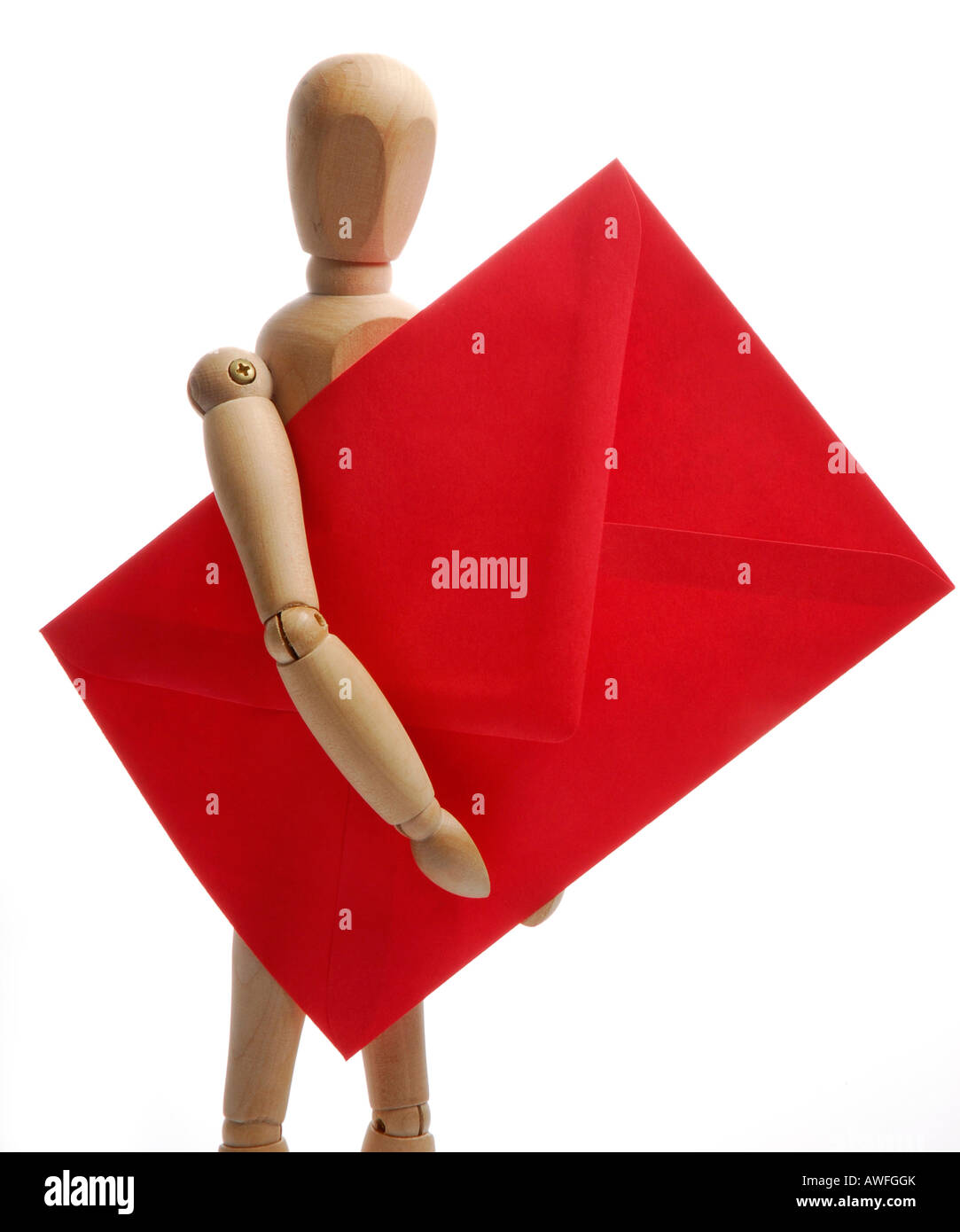 Jointed mannequin holding a red envelope Stock Photo