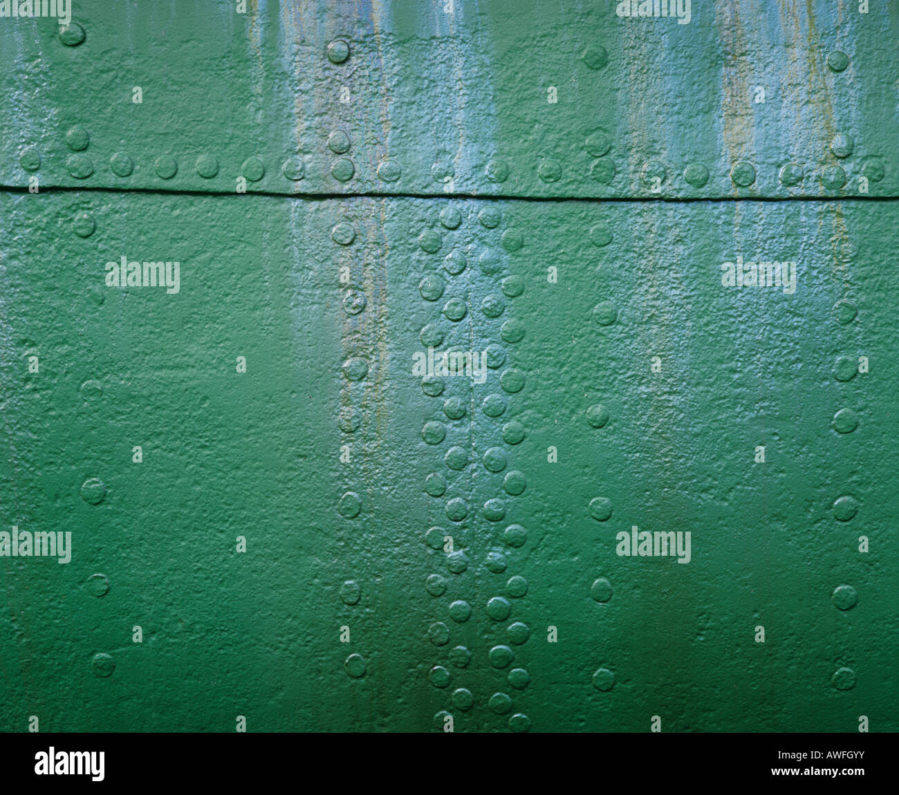 Green metal surface with rivets Stock Photo Alamy