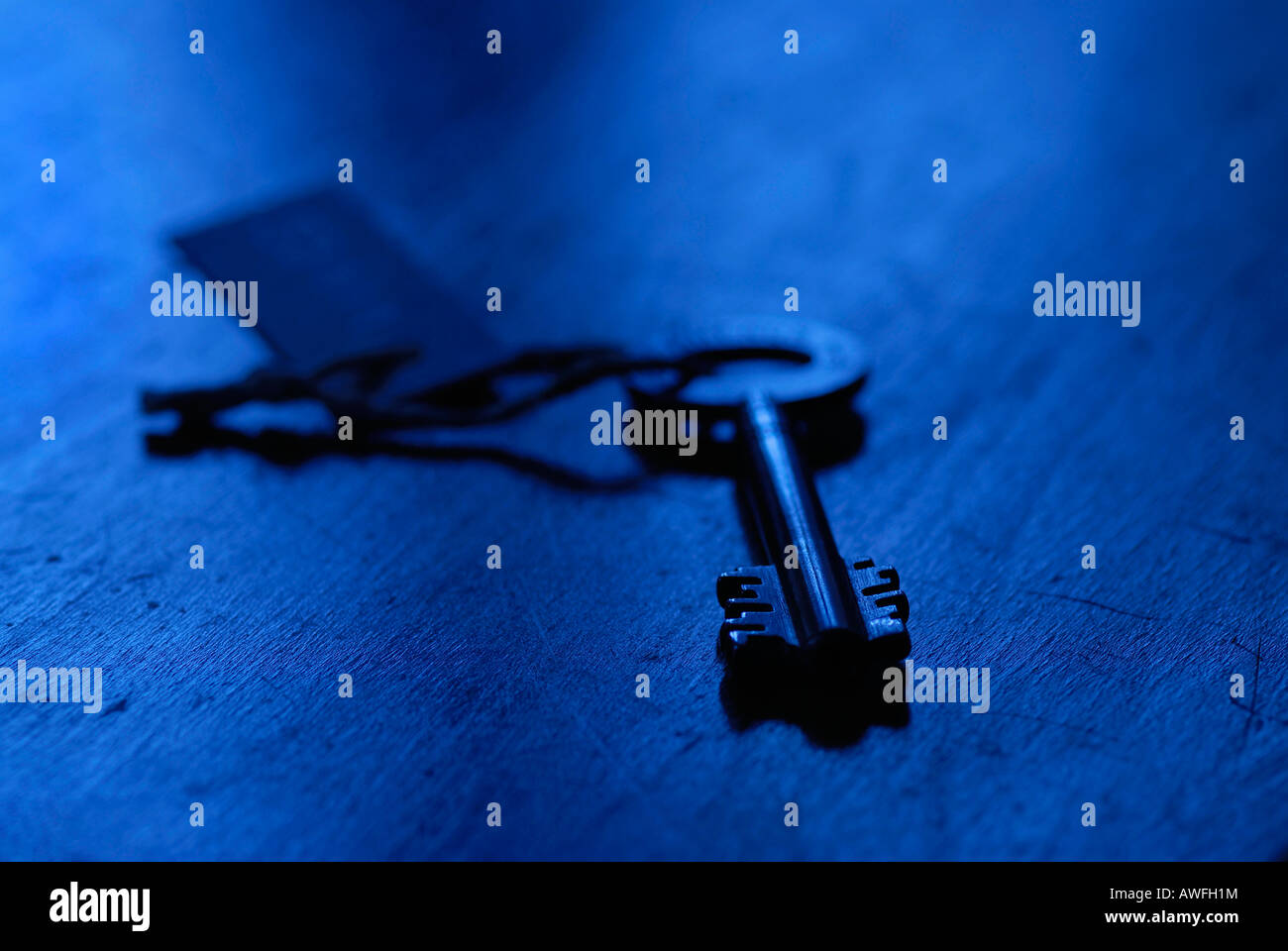 Old safe key on keychain Stock Photo