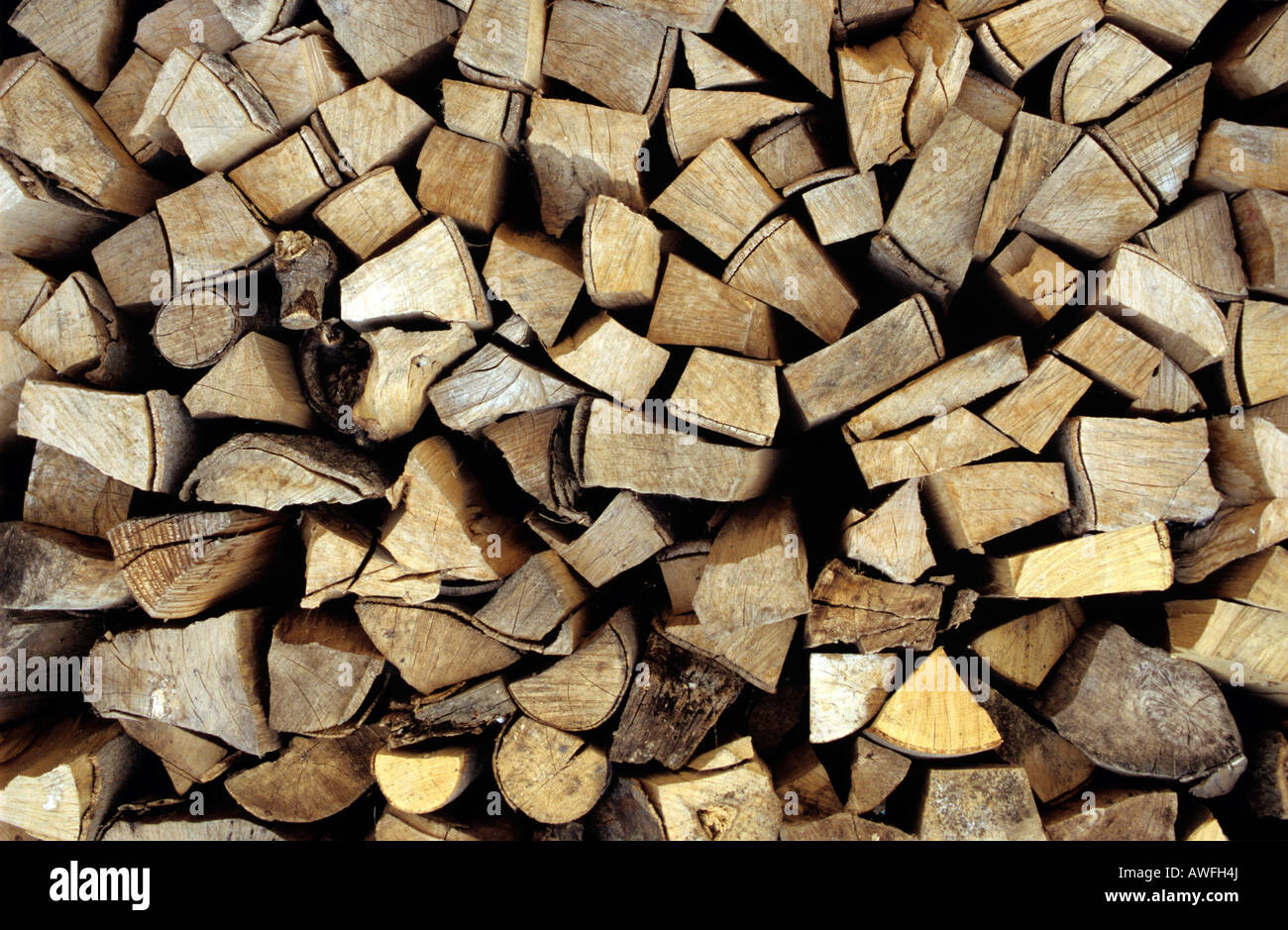 Stacked firewood, image-filling Stock Photo