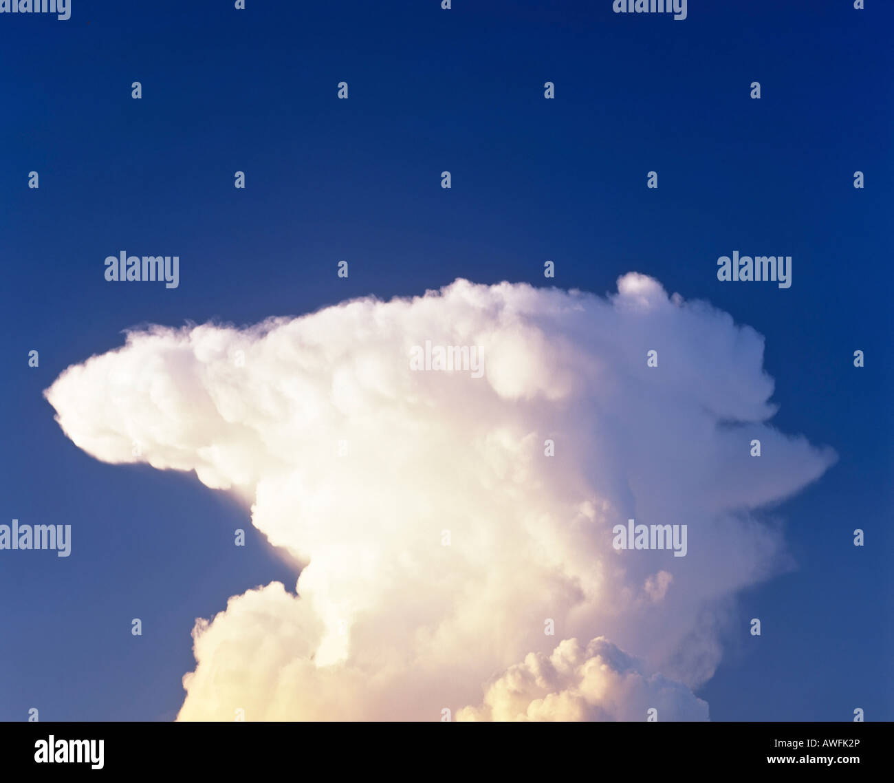 Cumulonimbus thunderclouds in a blue sky, approaching thunderstorm Stock Photo