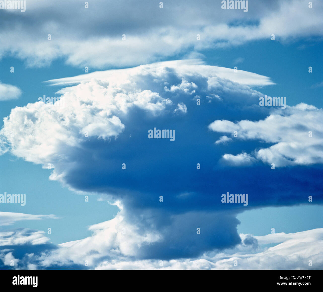 Cumulonimbus thunderclouds in a blue sky, approaching thunderstorm Stock Photo