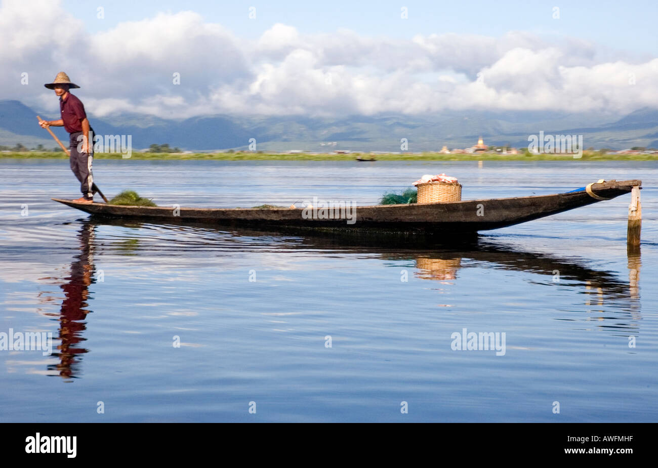 Stock photograph of a leg rowing fisherman on Inle Lake in Myanmar ...