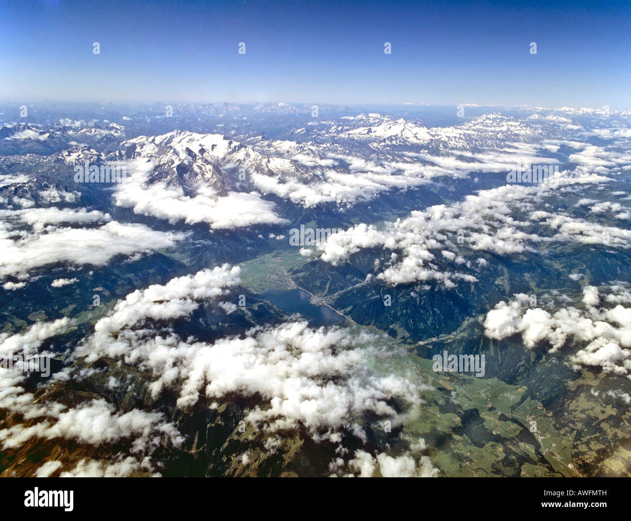Aerial shot, Tennen Range, Dientener Mtns. (below), Zell am See (middle), Hohe Tauern Range, Pinzgau, Mt. Grossglockner and Mt. Stock Photo